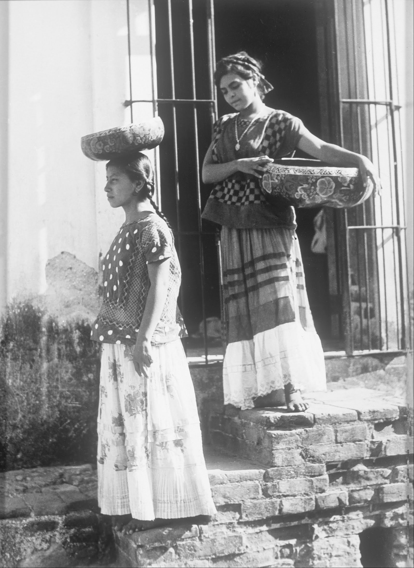 Two Women from Tehuantepec with jicalpextle by Tina Modotti
