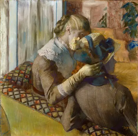 At the Milliner's by Edgar Degas