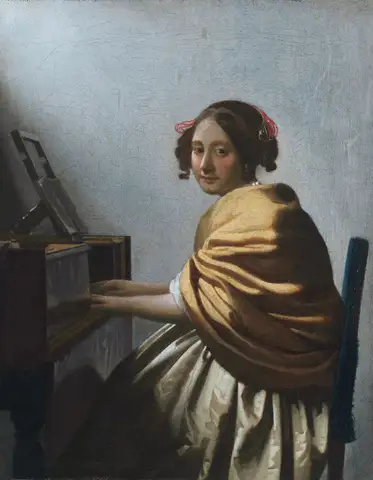 A Young Woman Seated at the Virginals by Johannes Vermeer